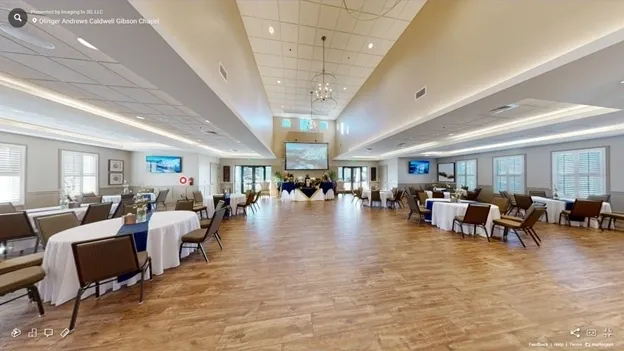 A large room with many tables and chairs.