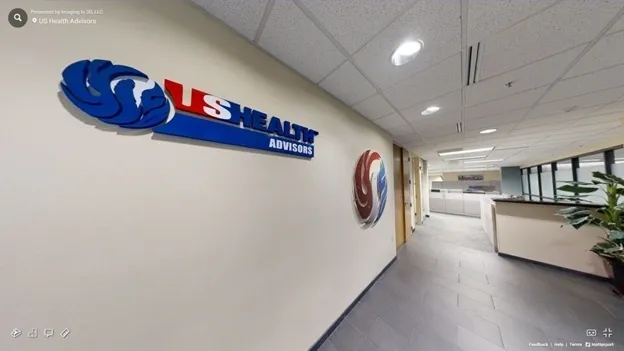 A hallway with two signs on the wall.